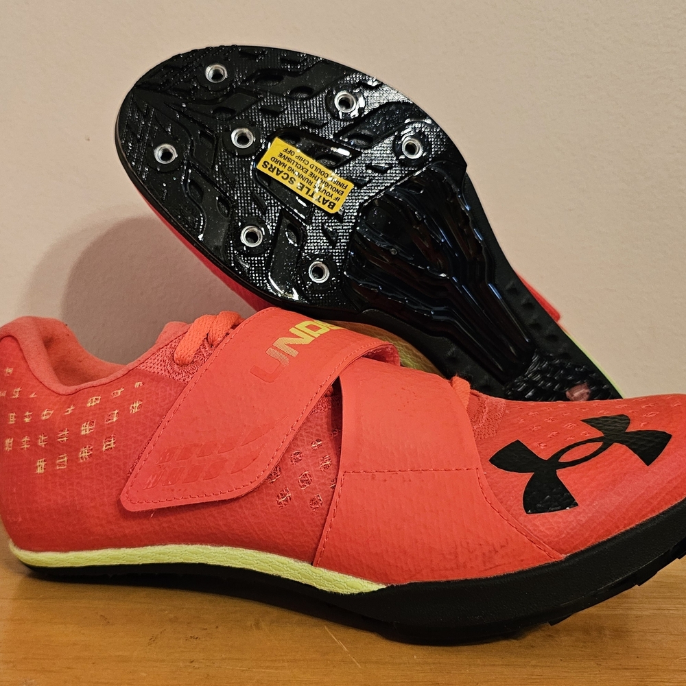 The Under Armour HOVR Skyline Long Jump Track Spikes in Phoenix Fire/High-Vis